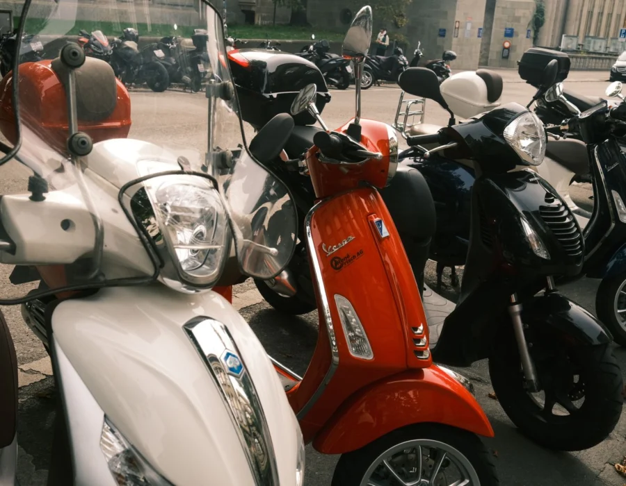 Colourful scooters parked in a street