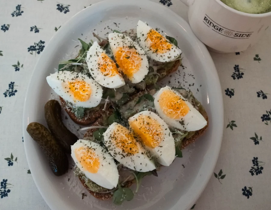 Avocado toast with boiled eggs on a table