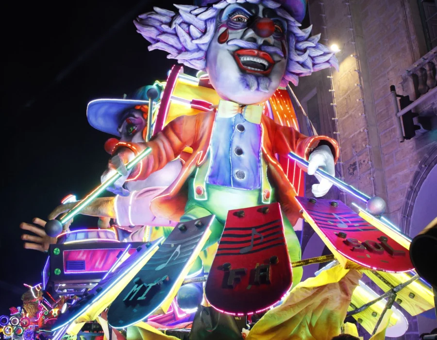 A carnival float lit up at night