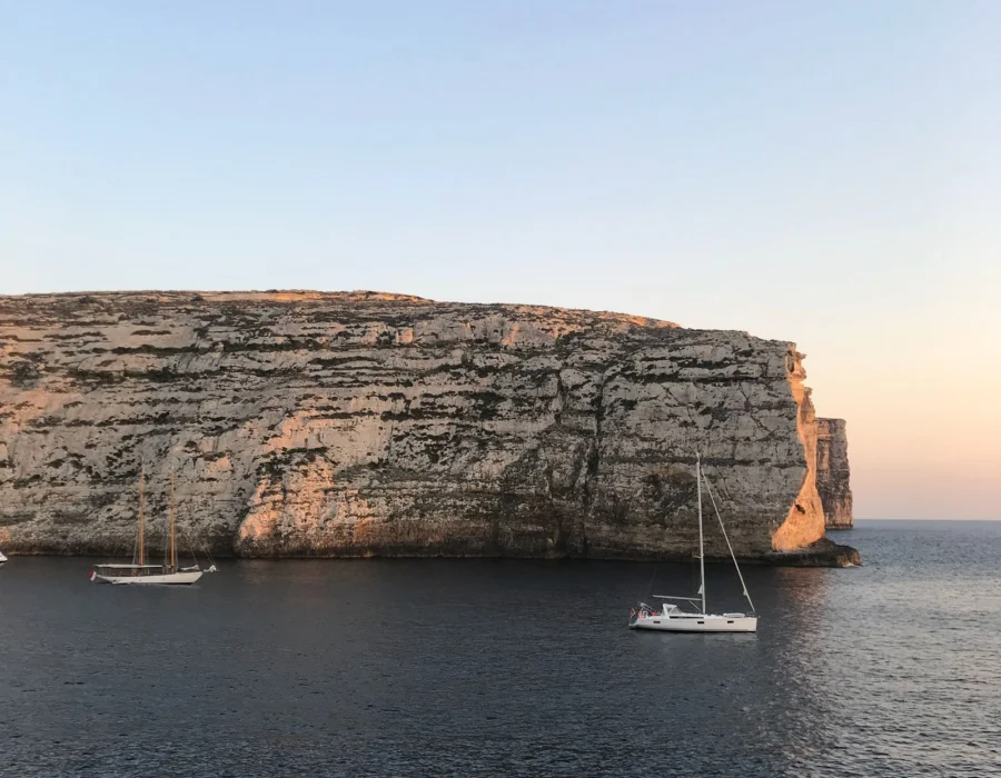 A quiet coastal path along Maltese cliffs at golden hour