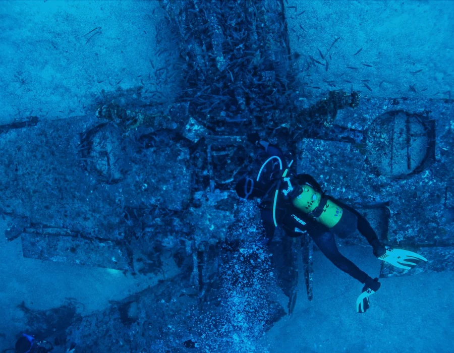 A diver exploring an underwater wreck off Malta