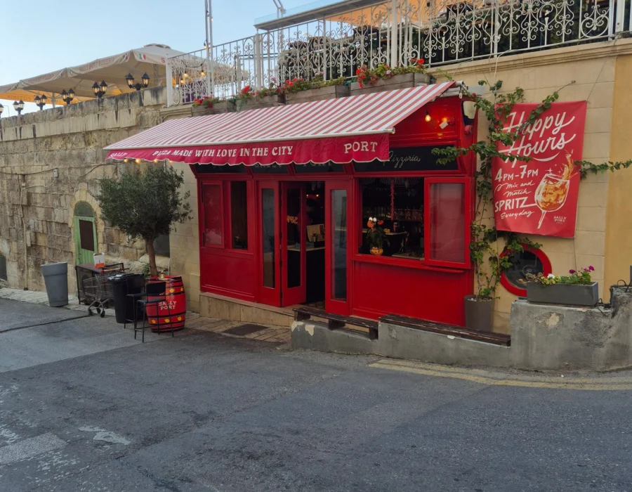 A cafe with a red facade on a quiet street