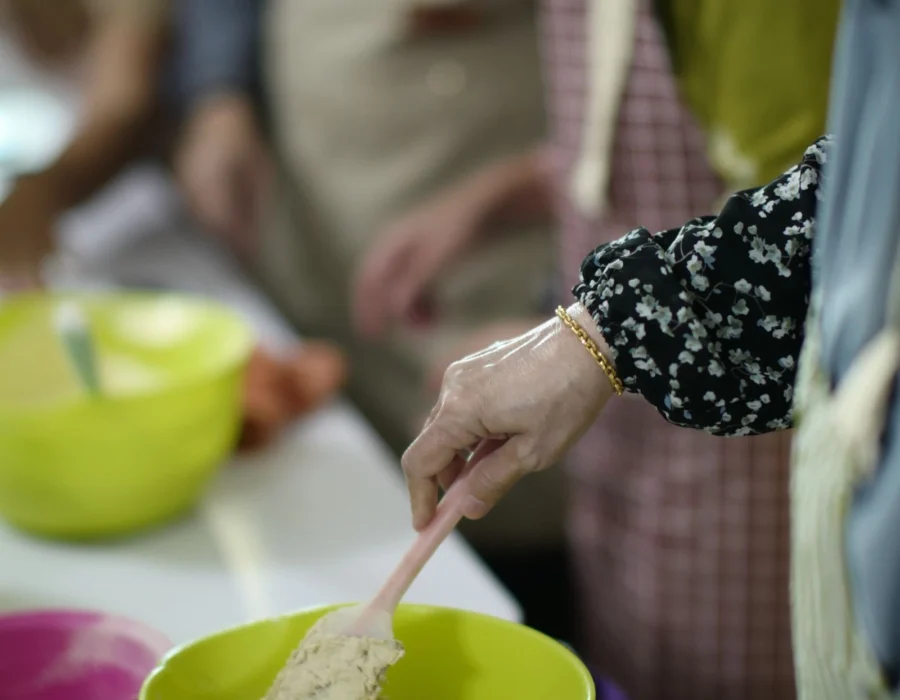 Hands working dough at a Maltese cooking class