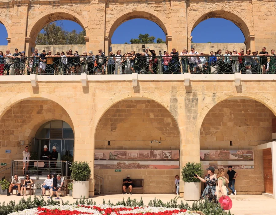 Visitors looking out over the Grand Harbour from the Upper Barrakka Gardens