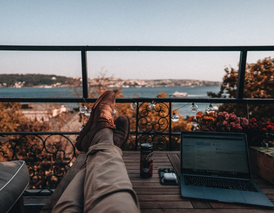 Working on a laptop on a balcony