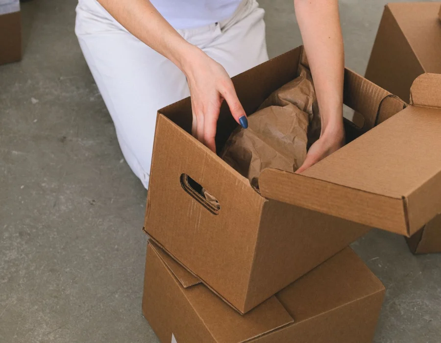 Packing belongings into cardboard boxes