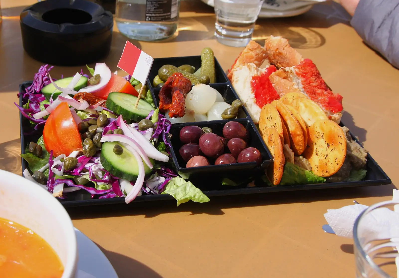 A Maltese platter with gbejniet, bigilla and bread