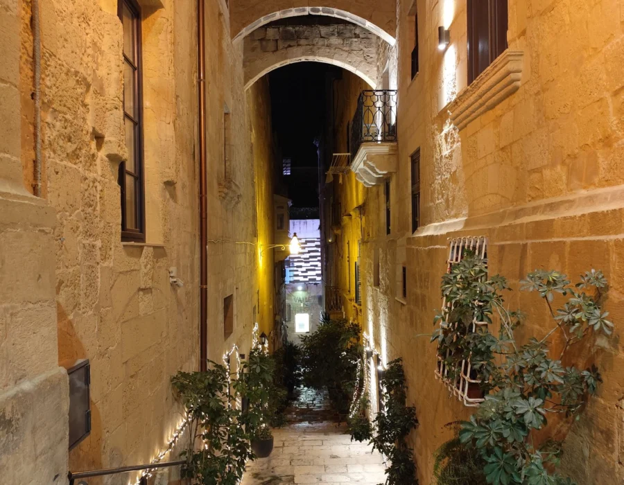 A Valletta street lit up late at night