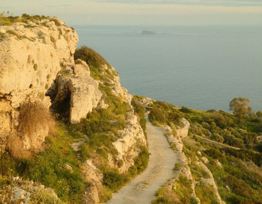 A coastal path on the Maltese cliffs at golden hour