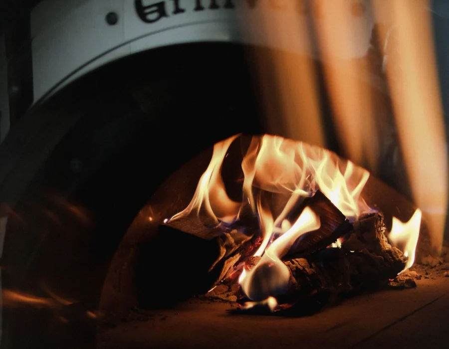 Flames inside a rustic wood-fired oven