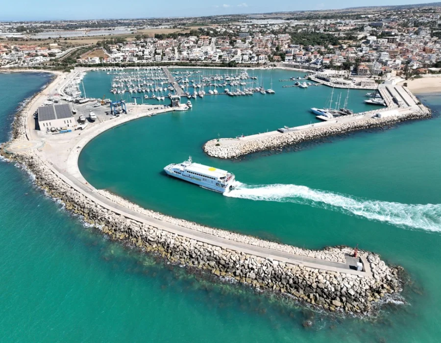 Marina di Ragusa from the air, with a fast catamaran leaving the harbour