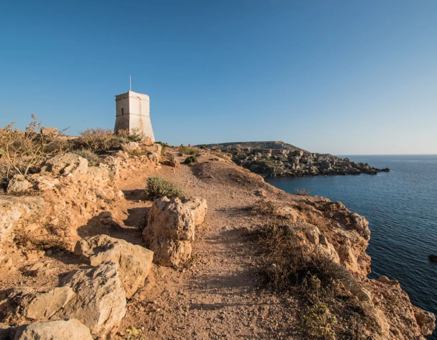 Ghajn Tuffieha tower above a rocky coastline