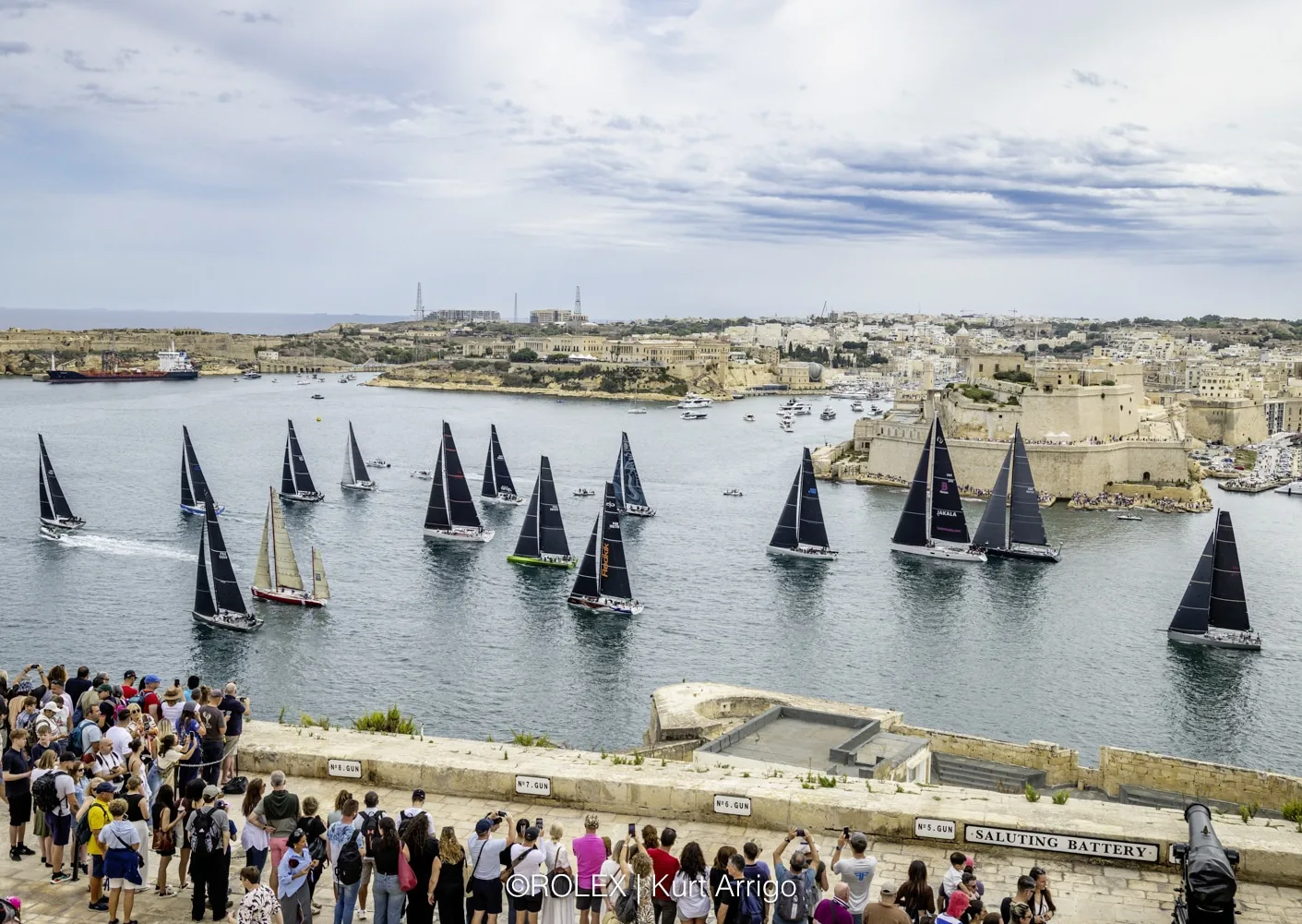 Yachts at the start of the Rolex Middle Sea Race in the Grand Harbour, watched from the Saluting Battery